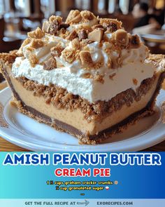 a piece of cake sitting on top of a white plate with whipped cream and walnuts