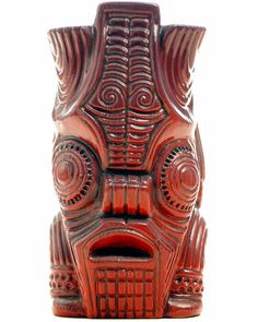 a red wooden statue with intricate designs on it's face and eyes, isolated against a white background