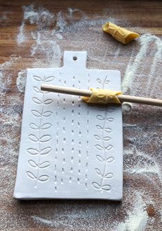 a spatula with some food on it sitting on a piece of wax paper next to other items