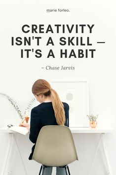 a woman sitting at a desk writing on a piece of paper with a quote above her