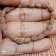 "Our Two Mukhi Bracelet is handcrafted with natural Two 2 Mukhi Rudraksha Beads. The most divine and beautiful form of unification is represented by the original 2 Mukhi Rudraksha. It symbolizes 'Ardhanareeshwara' which is the united form of Shiv and Shakti. The 2 Mukhi Rudraksha bead is the symbol of unification of mind and Soul symbolized by Shiva and Parvati or the Shivalinga. Wearing 2 Mukhi Rudraksha creates feelings of oneness and unity in any relationship between wife and husband, Guru Sh Adjustable Spiritual Bracelets For Festivals, Traditional Hand-strung Stretch Bracelet For Gift, Traditional Hand-strung Wristband As Gift, Adjustable Spiritual Jewelry For Puja, Traditional Adjustable Bracelet With 8mm Beads, Traditional Hand Wrapped Beaded Bracelets, Traditional Bracelets With 108 Beads For Festivals, Traditional 108 Beads Bracelet For Festivals, Adjustable Bohemian Bracelets For Puja