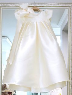 Fitted Baptism Dress With Bow, Cream Princess Style Sleeveless Baptism Dress, Princess Style Cream Summer Dress, White Bow Dress For Birthday, Cream Princess Dress For Baptism In Summer, Summer Cream Princess Dress For Baptism, Summer Baptism Cream Princess Dress, Cream Sleeveless Princess Dress For Baptism, Short Sleeve Baptism Dress With Bow