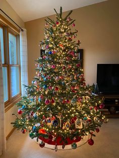 a decorated christmas tree in a living room