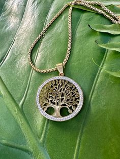 This necklace celebrates the Tree of Life, a universal spiritual symbol representing growth, wisdom, protection, beauty, strength and redemption.  The stainless steel pendant measures 1.25 inches in diameter and hangs on very high-quality tarnish-resistant stainless steel gold chain.*Please choose your desired chain length from the listing's menu.  This piece is stunningly accented with Cubic Zirconia gemstones.  Made with a lobster clasp to ensure secure and easy styling. * Arrives GIFT-READY i Spiritual Tree Of Life Jewelry Gift, Spiritual Tree Of Life Jewelry For Gifts, Spiritual Tree Of Life Jewelry As A Gift, Yoga Necklace, Dried Rose Petals, Symbol Necklace, Sacred Symbols, Crystal Tree, Tree Of Life Pendant