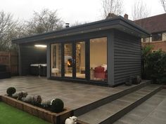 a small house with a patio and steps leading to it