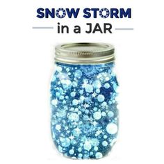 a jar filled with blue and white snow flakes