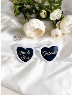 These gorgeous sunglasses are the perfect bringing some personalised fun to your wedding celebrations.  Make your wedding celebrations extra special with a personalised touch. Our White sunglasses have heart shape frames to bring an extra fun element, personalised on the dark lenses with your new shared surname. Creating fun moments for photos that will be treasured for years.  UV400 for protection.  ♥ SIZE ♥ in cm * Width - 15 cm  * Height - 6.5 cm  * Arm Length - 15.5 cm  ♥ PLEASE DON'T FORGET White Heart Sunglasses, Wedding Sunglasses, Fun Moments, Heart Shaped Frame, White Sunglasses, Mr And Mrs Wedding, Heart Sunglasses, Wedding White, Mr And Mrs