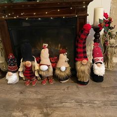 a group of gnomes sitting in front of a fireplace