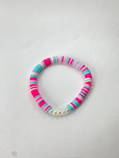 Blue/White/Pink clay bead bracelet with fun summer colors made by me. Pink Beaded Bracelets For Vacation, Pink Heishi Beads Friendship Bracelets For Vacation, White Fun Bracelets For Vacation, Fun White Bracelets For Vacation, Pink Round Beads Friendship Bracelets For Summer, Pink Round Beads Friendship Bracelets For Vacation, Pink Beaded Bracelet For Vacation, Vacation Pink Friendship Bracelets With Colorful Beads, Pink Beaded Friendship Bracelets For Vacation