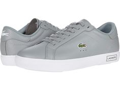 Lacoste Powercourt 0520 1 SFA - Women's Shoes : Grey/White : The Lacoste Powercourt 0520 1 SFA offers style and comfort with a low-profile construction, plain round toe, and color-block accents. Leather and synthetic upper materials. Lace-up design for a secure fit. Signature logo accents at the tongue, side, and heel. Breathable man-made lining. OrthoLite cushioned footbed for all-day comfort. Man-made outsole. Imported. Measurements: Weight: 14 oz Product measurements were taken using size 9, Sporty Sneakers With Embossed Logo, Gray Casual Sneakers With Logo, Casual Sneakers With Appliqué Logo For Streetwear, Casual Streetwear Sneakers With Appliqué Logo, Sports Sneakers With Embossed Logo In Synthetic Material, Sports Sneakers With Embossed Logo In Synthetic, Synthetic Sneakers With Embossed Logo For Sports, Sporty Sneakers With Logo Detail For Sports, Synthetic Sneakers With Logo For Streetwear