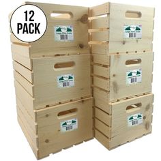 several wooden crates stacked on top of each other with labels reading 12 pack in front of them