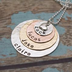 "This is my most popular necklace for mothers, grandmothers, or pet lovers! I begin with a 1/2\" sterling silver disc (9 characters max), then a 3/4\" copper disc (12 character max), a 1\" brass disc(16 character max) and last a 1-1/4\" silver disc (20 character max). All discs are hammered and are personalized with names of your choice. The pendant is topped with a sterling silver heart charm. Hangs from a sterling silver chain. **Please read my store policy about copper and brass jewelry befor Round Pendant Necklace With Hallmark For Mother's Day, Stamped Round Pendant Charm Necklace For Mom, Sterling Silver Charm Necklaces For Mother's Day, Sterling Silver Round Disc Charm Necklaces For Mother's Day, Sterling Silver Round Disc Charm Necklace For Mother's Day, Mother's Day Sterling Silver Round Disc Charm Necklace, Nickel Free Necklace For Anniversary, Nickel-free Necklace For Anniversary, Nickel-free Round Necklace For Anniversary