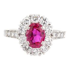 This is part of Chairish’s Fine Jewelry assortment.  Vintage Tiffany & Co ruby & diamond cluster ring crafted in 900 platinum (circa 1960s).    Oval mixed cut natural ruby measures 7.1 x 5.4 x 3.0mm (estimated at 1 carat). Color and inclusions are typical of rubies from Burma (Myanmar). There is no evidence of any treatments to the ruby. Sixteen diamonds total an estimated 0.70 carats (estimated at F-G color and VS clarity). The ruby is in good condition with two tiny chips evident (visible unde Classic Ruby Ring With Rose Cut Diamond Cluster, Classic Ruby Cluster Ring With Center Stone, Classic Cluster Ruby Ring With Center Stone, White Gold Ruby Cluster Ring With Brilliant Cut, Oval Ruby Ring With Platinum Center Stone, Oval Ruby Ring With Platinum Band, Oval Ruby Ring With Platinum Setting, Oval Ruby Ring With Platinum, Classic Cluster Ruby Ring