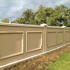 a fence that is next to some grass