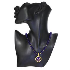 The Royal Collection is inspired by an intricate mosaic of royal palaces around the world. From exotic Marrakesh and colorful Barcelona, to the magical islands of Greece, it reminds us that we’re all descendants of kings. Handmade in NYC. Limited Edition. Price includes 18-inch (457.2 mm) strand of round amethyst beads. Enhancer dimensions: 41 mm L by 29 mm W. For additional wearability and pricing options, please contact us. Metal: 18 karat yellow gold. Center Amethyst: 1 stone, total carat wei Luxury Purple Necklace With Gemstone Beads, Luxury Amethyst Gemstone Beads Jewelry, Luxury Purple Pendant Necklace, Luxury Tanzanite Jewelry With Gemstone Accents, Opulent Gemstone Necklace For Gift, Luxury Necklace With Stone Setting For Gift, Luxury Necklaces With Stone Setting For Gift, Luxury Gift Necklace With Stone Setting, Luxury Amethyst Necklace With Gemstone Accents