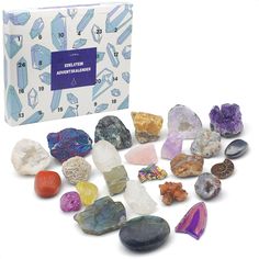 various rocks and crystals in front of a white box with numbers on the back side