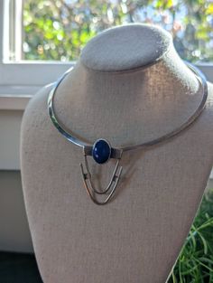 A stunning sterling silver modernist choker necklace that looks like a piece of art! The pendant has a beautiful geometric modern shape with a lapis stone in the center. The collar is rigid and solid and can be worn without the pendant which slides in. The choker is simple and easy to match with other pendants (must be large enough to fit). It is made in Mexico and stamped 925. The pendant is signed S McCrory and Sterling. it has a secure and nice closure in the back. A beautiful statement piece Flatware Jewelry, Character Clothing, Lapis Stone, Lapis Jewelry, Fancy Jewelry Necklace, Collar Choker, Art Deco Glass, Knitting Supplies, Geometric Necklace