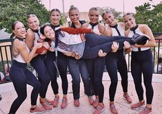 a group of young women standing next to each other