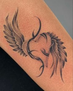 a woman's arm with an angel tattoo on it