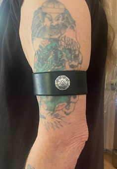 This is a black leather upper arm cuff/band with a screwback silver plated Thunderbird concho...this band is adjustable with the leather lace on the back....I left the lace extra long to give you the option to trim it where you would like it. measurements are 9 1/2  inches long and 1 1/2 inches wide Punk Style Silver Cuff Leather Bracelet, Punk Style Silver Leather Cuff Bracelet, Adjustable Silver Concho Cuff Bracelet, Silver Adjustable Leather Bracelet With Wrist Strap, Adjustable Silver Gothic Wristband, Adjustable Silver Leather Bracelet With Wrist Strap, Silver Gothic Adjustable Wristband, Gothic Adjustable Silver Wristband, Gothic Silver Adjustable Wristband