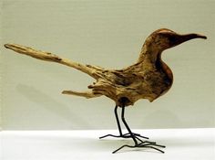 a bird made out of wood and metal