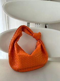 GIFT WRAPPING AVAILABLE: simply mark your order as a "gift" Introducing our stylish dumpling bag with woven knot detail, perfect for the modern woman on-the-go! This hobo shoulder braid bag in trendy orange color is not only a fashion statement but also a functional accessory. With its unique design and high-quality craftsmanship, this best seller is sure to impress. Treat yourself or surprise your girlfriend with this must-have gift that will elevate any outfit effortlessly. Order yours today a Trendy Tote Baguette Bag As Gift, Baguette Bag With Removable Pouch As Gift, Trendy Handheld Baguette Bag Gift, Gift Shoulder Bag With Braided Handles And Satchel Shape, Satchel Shoulder Bag With Braided Handles For Gifts, Satchel Shoulder Bag With Braided Handles As Gift, Trendy Pouch Baguette Bag As Gift, Trendy Baguette Pouch Bag As Gift, Trendy Baguette Shoulder Bag For Gift