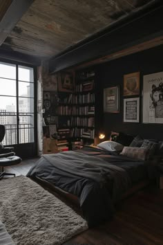 a bedroom with black walls and wooden floors