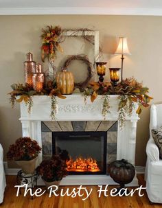 a living room filled with furniture and a fire place in front of a white fireplace