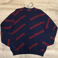 Balenciaga Allover Logo Sweater In Size L. Fabulous Balenciaga Sweater With Repeat Logo. Brand New! No Flaws. Navy Blue And Red Wool Jacquard Knit Sweater. Never Been Worn. These Balenciaga Sweaters Are Timeless! Measurements Are Shown In Photos. Balenciaga Allover Logo Sweater Designer Winter Sweater With Logo Detail, Designer Blue Sweater For Winter, Designer Blue Sweater For Fall, Designer Blue Long Sleeve Sweater, Designer Long Sleeve Blue Sweater, Blue Sweater With Logo Detail For Fall, Luxury Blue Long Sleeve Sweater, Blue Logo Print Sweater For Fall, Fall Blue Sweater With Logo Print