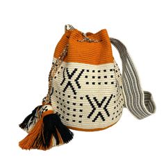 These Boho Bags with Tribal patterns are the ultimate accessory for your casual outfits. Their Neutral tones go with everything. These Bohemian style bags can be worn on the shoulder or crossbody. Details: Large Bucket Style Crochet Bag Crossbody or Shoulder. Drawstring closure Double-thread crochet technique. Material: Acrylic threads (70%Cotton / 30% Polyester) Overall dimensions (approximate): Boby: 11” H x 9.5” W; Strap: 2.5” W. Drop 20" Machine washable (following special care instructions) Bohemian Style Bag, Crochet Boho Bag, Limited Edition Bag, Boho Bags, Pumpkin Pattern, Boho Bag, Thread Crochet, Crochet Techniques, Large Bags