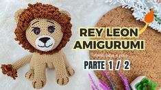 a crocheted lion is sitting next to some flowers and an egg shell with the words, rev leon amgurmi parte 1 / 2