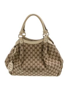 Gucci HoboNeutrals CanvasGG Canvas & Sukey LogoGold-Tone HardwareLeather TrimRolled Handles & Dual Shoulder StrapsLeather Trim EmbellishmentCanvas Lining & Single Interior PocketSnap Closure at Top Gucci Top Handle Bag, Gucci Top, Bags Gucci, Handbag Handles, Brand Bags, Designer Gifts, Accessories Jacket, Chanel Shoes, Fine Jewellery Earrings