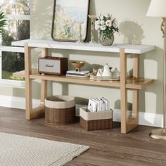 a white marble top console table in a living room