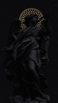 an angel statue in the dark with its wings spread out and head turned to the side