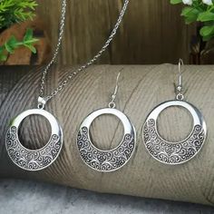 Attractive filigree round-shaped modern necklace and drop earrings set. To avoid tarnish, limit exposure to water, perfume, or body cream. 2-day processing. Shipped in 4-7 days. Earrings Necklace Set, Water Perfume, Modern Necklace, Satchel Backpack, Modern Necklaces, Accessories Jewelry Earrings, Silver Filigree, Hair And Beard Styles, Women Accessories Jewelry