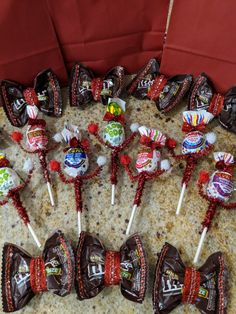 candy lollipops are lined up on a table