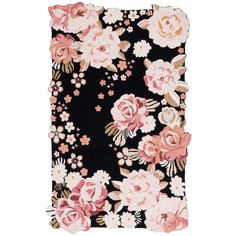 a black and pink flowered rug on a white background