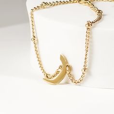 This exquisite bracelet features a delicate satellite chain adorned with a personalized Arabic letter charm. The bracelet's chain has tiny, evenly spaced beads adding a touch of sparkle and elegance. The focal point of this stunning piece is the Arabic letter charm, meticulously designed and crafted to capture the beauty and intricacy of the letter. Perfect for everyday wear or special occasions, this bracelet makes a meaningful and stylish statement, whether worn alone or layered with other pie Elegant Everyday Bracelets With Moon Charm, Minimalist Beaded Bracelets With Satellite Chain For Gift, Minimalist Satellite Chain Bracelet As Gift, Minimalist Satellite Chain Bracelet Gift, Minimalist Bracelet With Moon Charm As Gift, Minimalist Bracelets With Moon Charm As Gift, Elegant Metal Bracelets With Satellite Chain, Elegant Metal Bracelet With Satellite Chain, Elegant Personalized Metal Beaded Bracelets