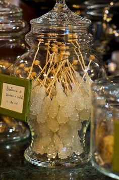 a glass jar filled with lots of white candies