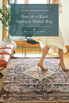 a woman standing on top of a rug in front of a window with the words, one - of - a - kind antique mahl rug