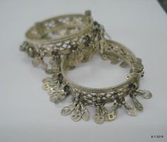 Vintage Antique ethnic collectible very nice tribal old silver charm Bracelet or bangle pair from Rajasthan India. Worn by Banjara tribal people of Rajasthan. Beautiful workmanship all over the piece, adorn with silver charms. One quarter-hinged part can be open by pin. Original old pair in good condition with great antique look. great pair for jeweley collection. Inner diameter across - 5.3 cm(2")Inner circumference -16.6 cm (6.5")width include charms - 2.6 cm(1")weight for pair - 92.5 gramsmat Heavy Silver Bracelet For Festivals, Nickel-free Traditional Bangle Jewelry, Silver Bangle For Festival, Silver Festival Bangle Jewelry, Silver Oxidized Bangle For Festival, Traditional Nickel-free Bracelet Jewelry, Silver Bangle With Oxidized Finish For Festival, Bohemian Silver Bracelets For Festive Occasion, Bohemian Silver Bracelet For Festive Occasion