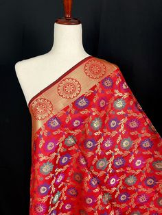 Beautiful Red Color Semi Banarasi Silk with Floral Pattern, Meenakari Work and Zari Weaving. Borders and Tassles at both the ends make the dupatta stand out.  Will make a perfect Gift !! Item: Dupatta Base color : Red Color  Fabric : Semi - Soft Silk Work : Meenakari, Zari Weaved with tassels Length of the Dupatta : 92 inches approx. Width of the dupatta : 34 1/2 inches (Approx.) Store Policies - No return or exchange will be accepted for color variations. - No return or exchange will be accepted if the color does not match your other clothing or your partners or anyone else. - Since this Dupatta is handmade hence little inconsistencies may be there however it is not considered as a defect. - Zari or thread coming out or on folds is not considered as defects. - Slight variation in actual c Luxury Katan Silk Dupatta With Bandhani Print, Luxury Katan Silk Dupatta With Printed Border, Men's Ethnic Wear, Bandhani Saree, Readymade Blouse, Silk Dupatta, Banarasi Sarees, Cotton Silk, Red Color