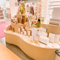 a display in a store filled with lots of cards and vases full of flowers