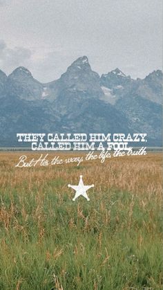 a field with mountains in the background and a quote written on it that reads, they called him crazy called him a star