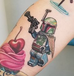 a star wars tattoo with boba fett and ice cream on the arm is shown