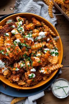 Buffalo Chicken Fries with Creamy Ranch. Crispy crinkle fries loaded in golden fried chicken bites dripping in a buttery buffalo sauce and drenched with a homemade creamy and herbaceous ranch sauce finished with some freshly chopped chives. Chicken Loaded Fries, Fried Chicken Bites, Buffalo Chicken Fries, Crinkle Fries, Buffalo Chicken Nachos, Chicken Fries, Creamy Ranch, Loaded Fries, Baked Asparagus