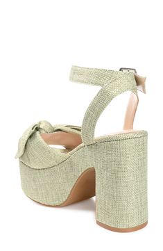 Elevate any outfit with this sweet bow-embellished sandal cushioned by a Tru Comfort Foam footbed and lofted by a dramatic platform block heel. 4.5" heel; 2" platform Open toe Bow accent Woven upper Ankle strap with adjustable buckle closure Foam cushioned footbed Block heel Platform sole Synthetic upper, lining and sole Imported