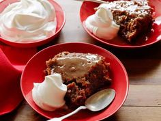 three red plates topped with dessert and whipped cream