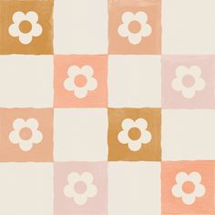 an orange, pink and white checkered wallpaper with flower designs on it's squares