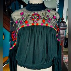 Beautiful Black Free People Long Sleeve Knit Blouse With Mesh Details. Brand New With Tags. $128 Retail. Mock Turtleneck With Two Buttons In Back, Elasticized Cuffs And Waste. Pictures Do Not Do This Blouse Justice. From A Clean, Non-Smoking, Pet Friendly Home. Multicolor Long Sleeve Mesh Top For Fall, Bohemian Tops For Fall Night Out, Black Fitted Bohemian Tops, Fitted Black Bohemian Tops, Stretch Tops For Fall Festival, Chic Black Tops For Festival, Waste Pictures, Free People Long Sleeve, Free People Blouse